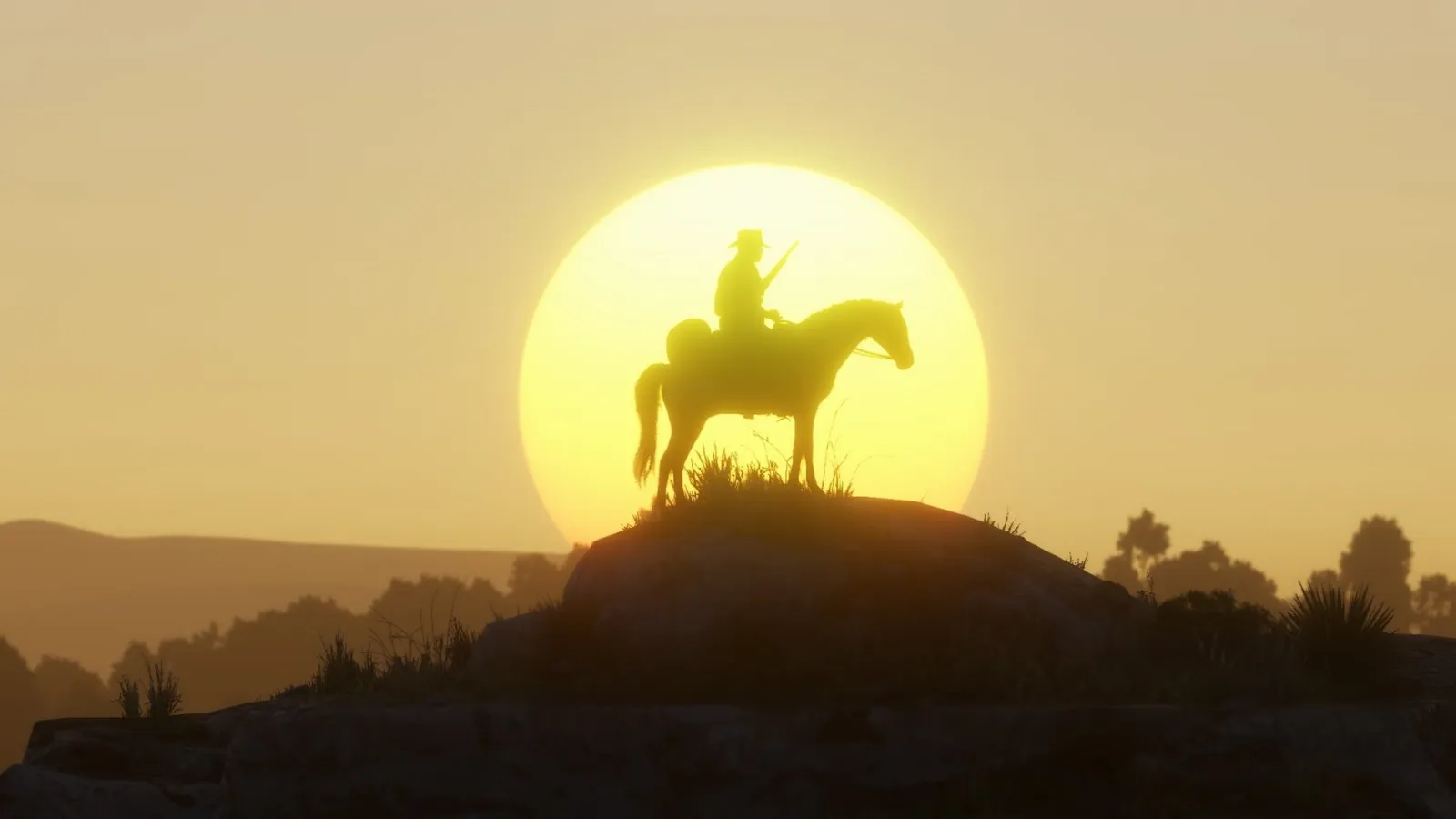 Jeździec na wzgórzu o zachodzie słońca w Red Dead Redemption 2