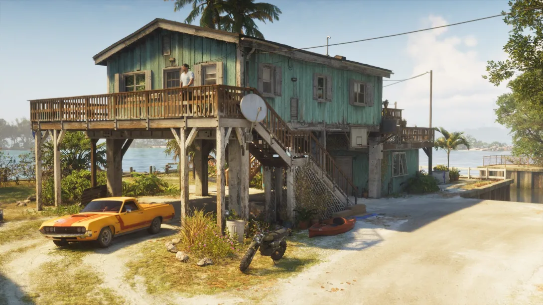 Una casa sobre pilotes en los Cayos con una moto, un kayak y un coche amarillo en el refugio de Jason en GTA 6 Ultimate Edition